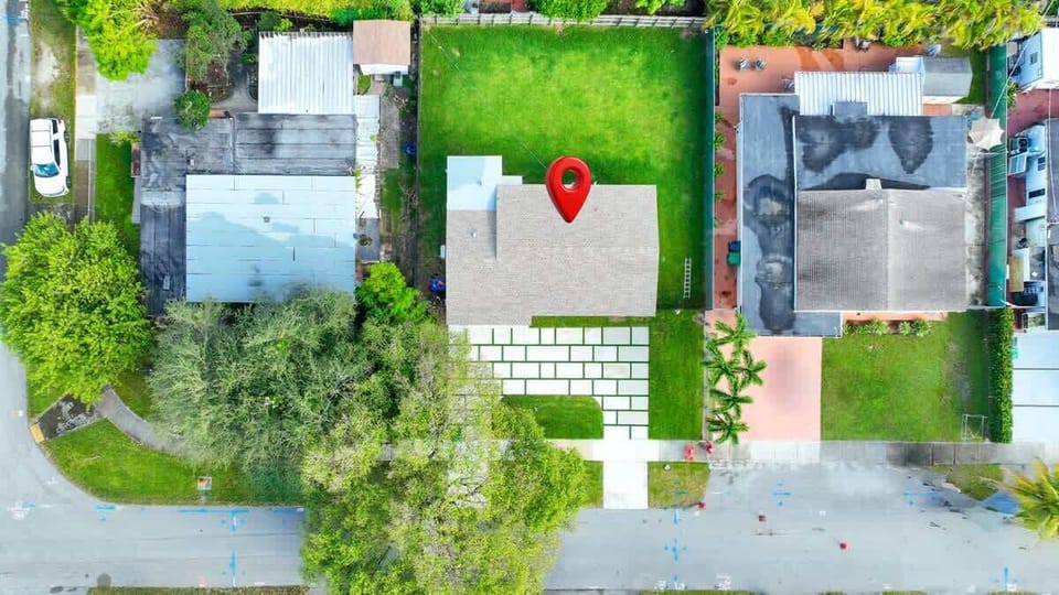 The  property from an aerial view, highlighting the yard and street access.