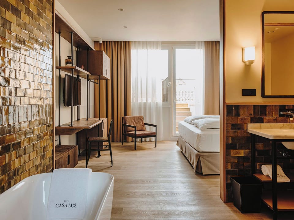 Premium bedding, down comforters, in-room safe, desk