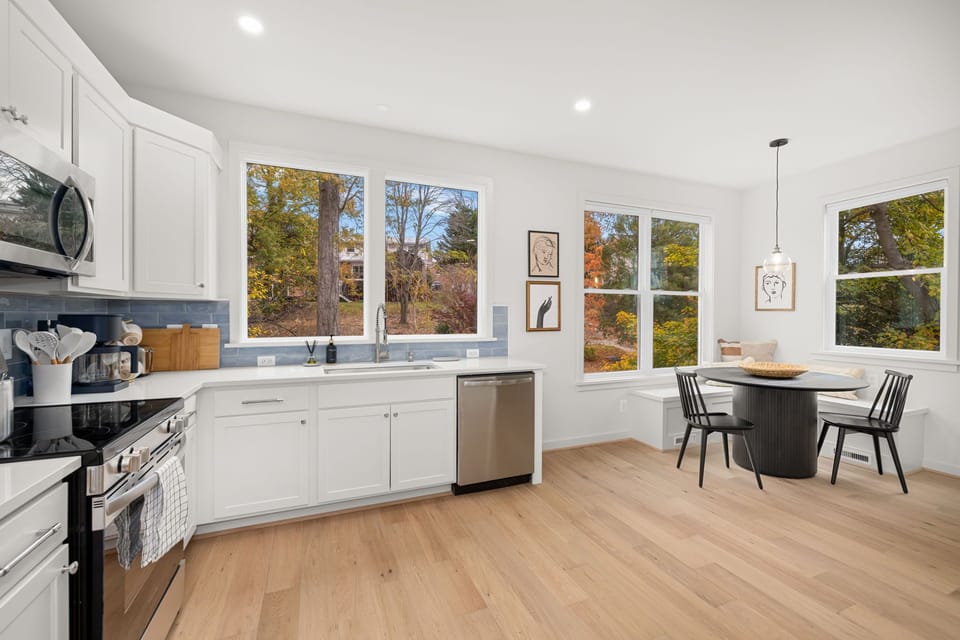 Open kitchen flows to charming breakfast nook