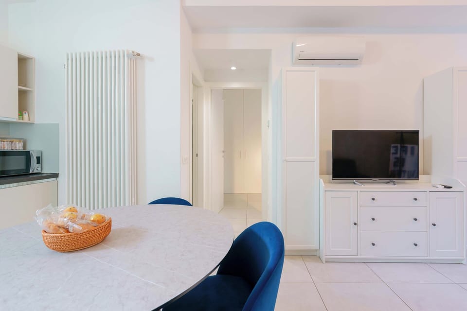 Apartment, 1 Bedroom, Balcony | Living area | Flat-screen TV, fireplace