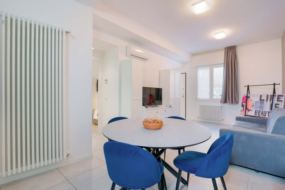 Apartment, 1 Bedroom, Balcony | Living area | Flat-screen TV, fireplace