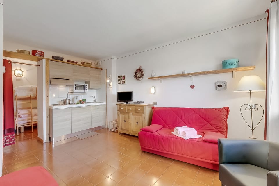 Standard Apartment, Multiple Bedrooms (Argentera Apartment) | Living area | 21-inch flat-screen TV with satellite channels, DVD player
