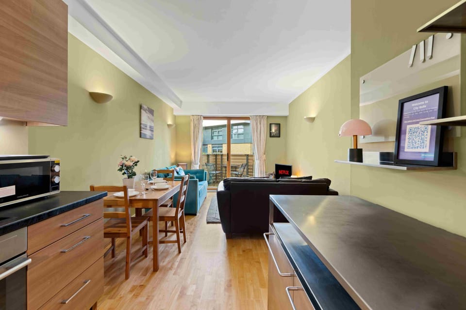 Spacious living area combining a sleek fitted kitchen and lounge space ideal for relaxing and socialising