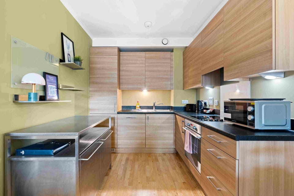 Fully equipped kitchen with modern appliances, cookware, and everything needed to prepare meals comfortably.