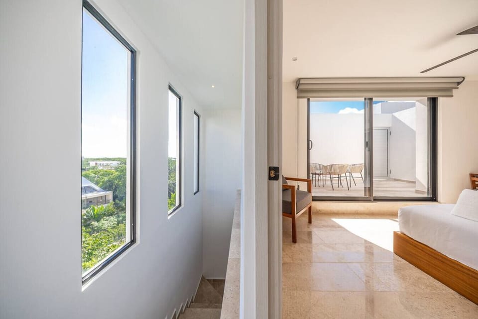 Bedroom with wide windows and a beautiful panoramic view.