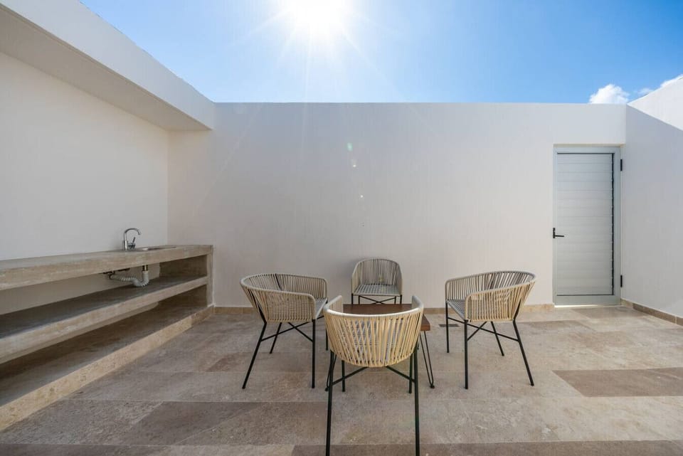 Private terrace with outdoor seating and grill perfect for relaxing or entertaining