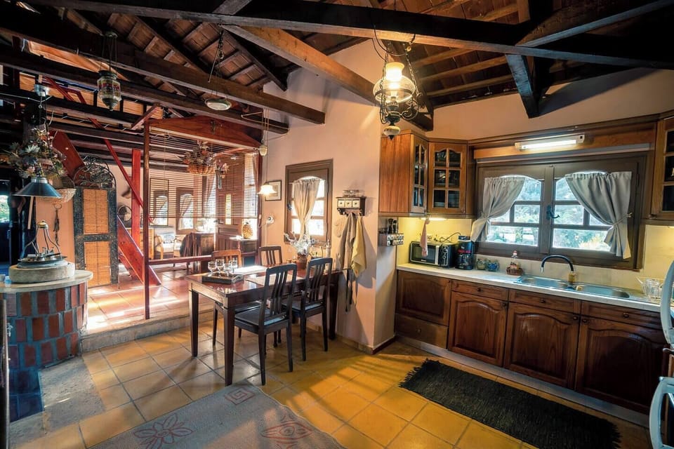Warm and welcoming kitchen-dining area full of rustic character