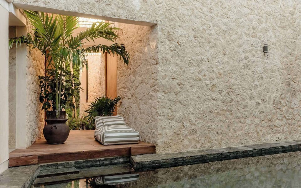 Architectural details in natural stone and warm textures.