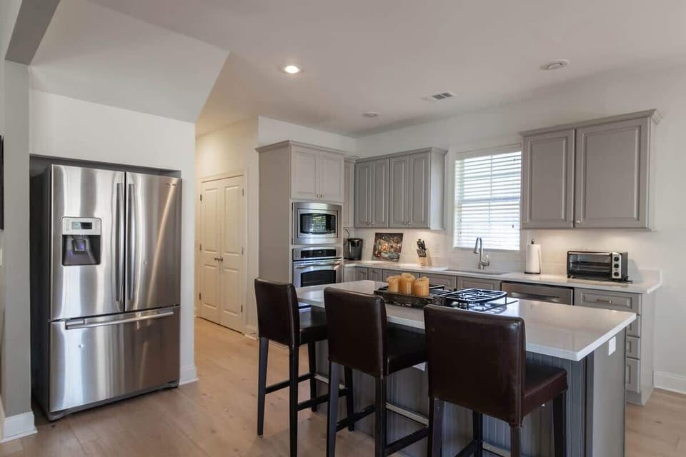 Three barstools at kitchen island.