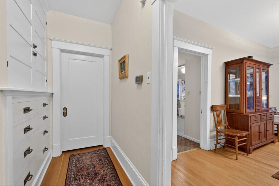 Lower-level hallway with built-in cabinets.