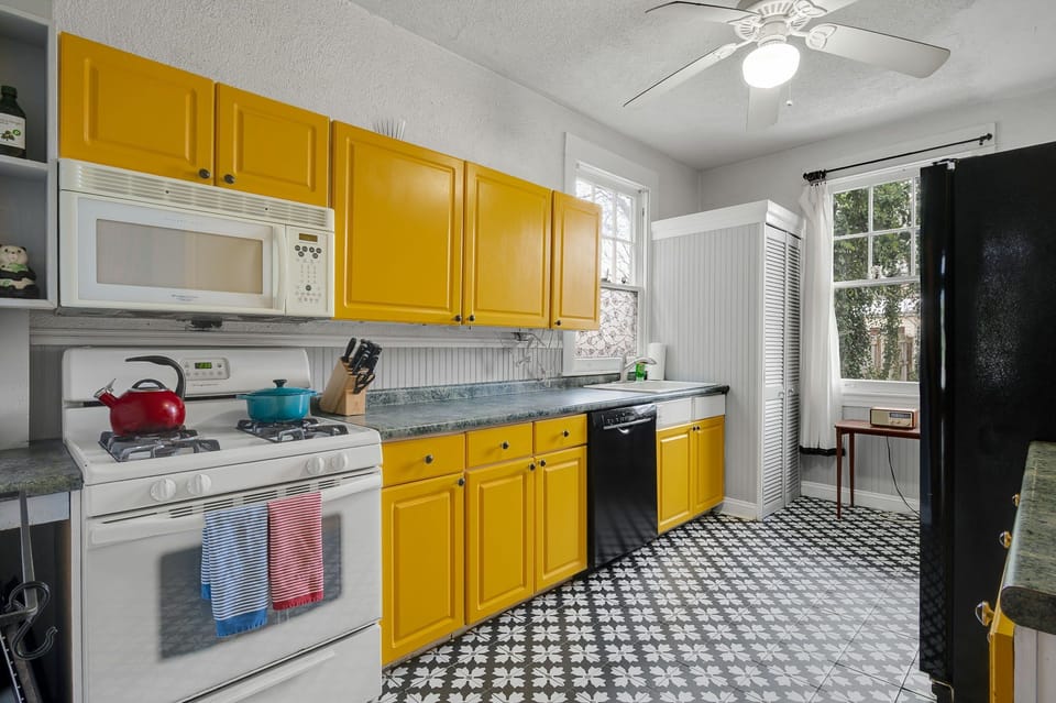 Vintage yellow kitchen with everything you need to cook a meal 