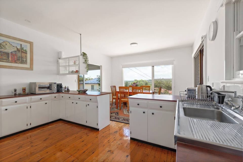 This kitchen also features an espresso machine, toaster and kettle, creating a convenient spot for simple breakfasts and relaxed starts to the day.
