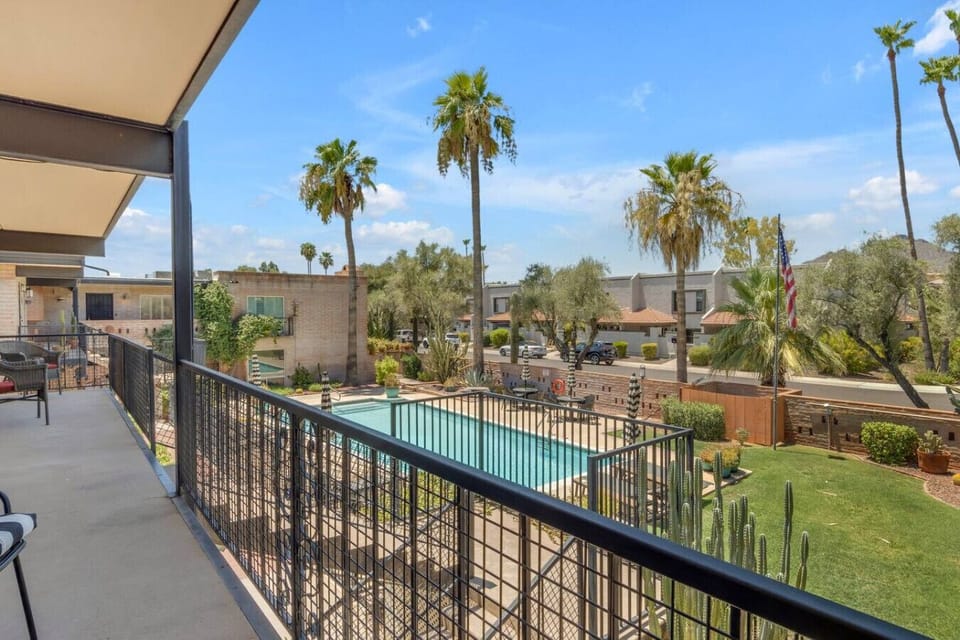 The walkway gives you a good look at the pool and the neighborhood palm trees.