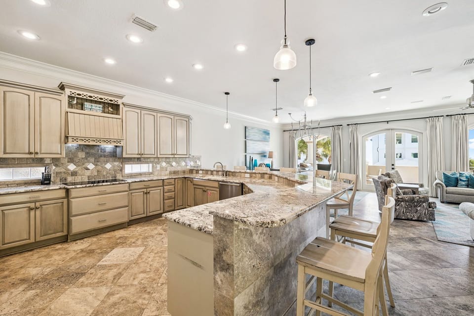 Your gourmet kitchen features granite countertops, premium appliances, and flows seamlessly into your comfortable living space.