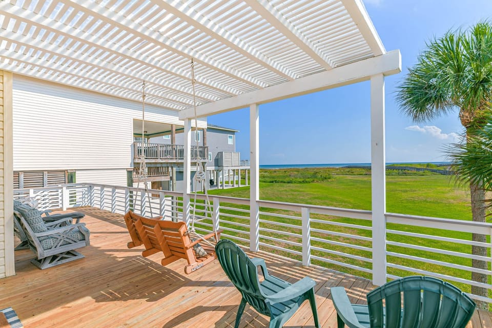 Enjoy views and your morning coffee on this spacious deck with plenty of seating, and porch swing.