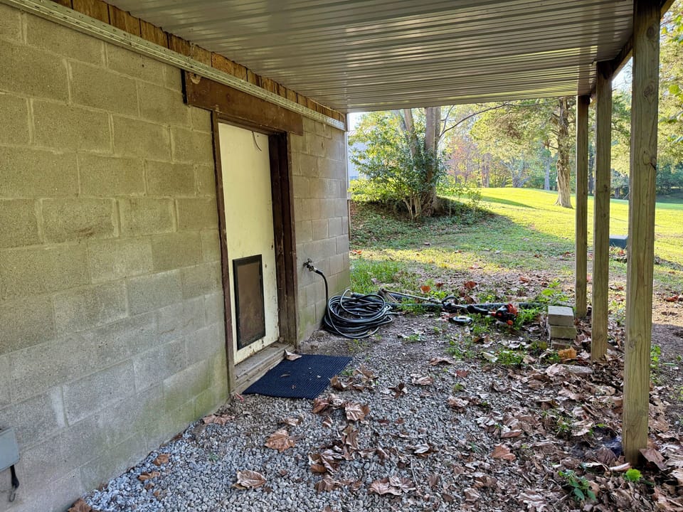 Back door located downstairs to covered outdoor area