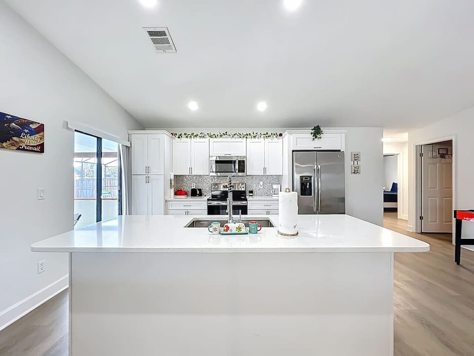 Fully equipped kitchen with dishwasher, oven, microwave, Fridge, Silverware, Pans pots, cups, dishes, seasonings, filtered water in fridge, coffee machine, espresso machine and coffee provided, toaster.