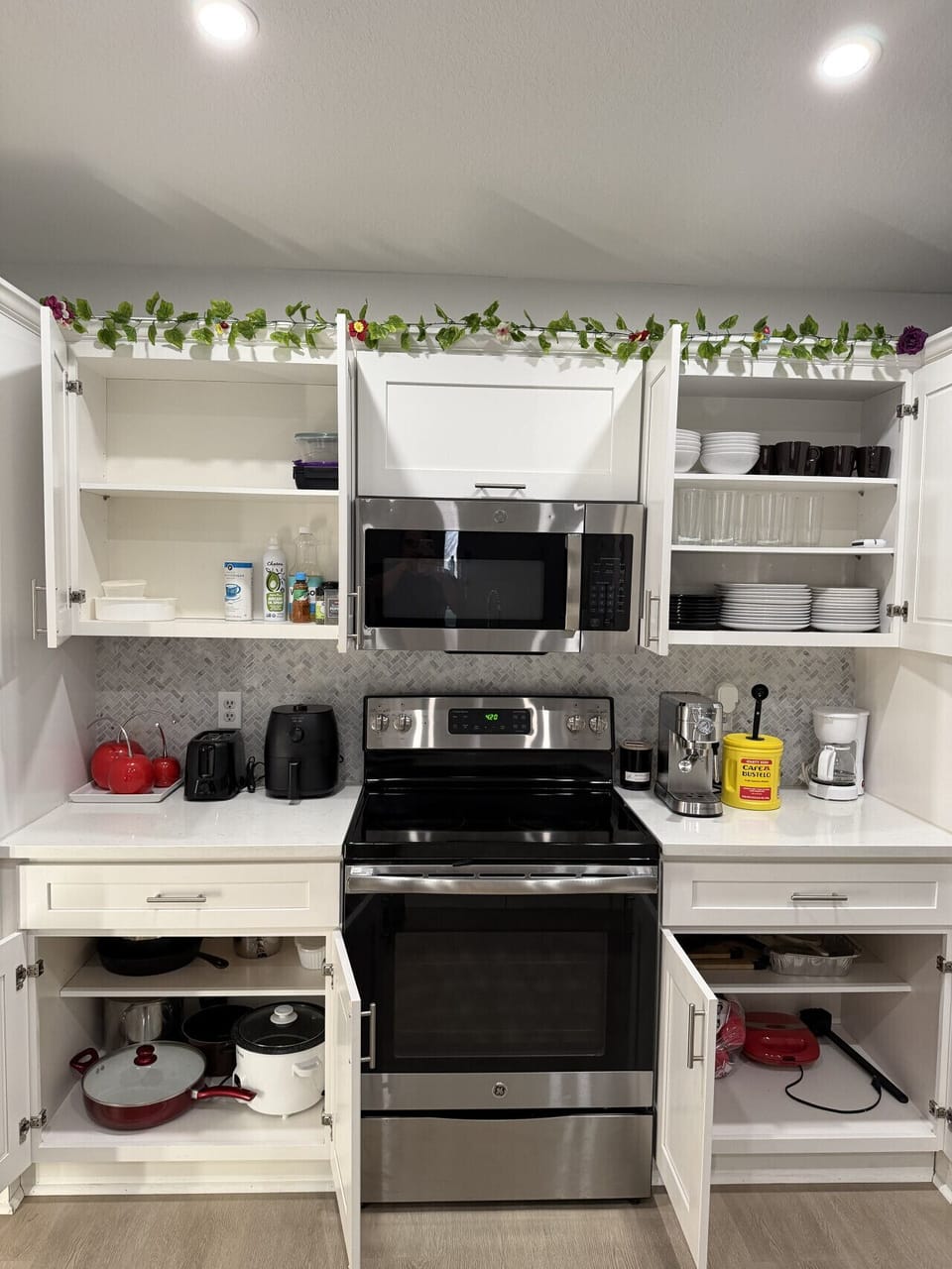 Fully equipped kitchen with dishwasher, oven, microwave, Fridge, Silverware, Pans pots, cups, dishes, seasonings, filtered water in fridge, coffee machine, espresso machine and coffee provided, toaster.