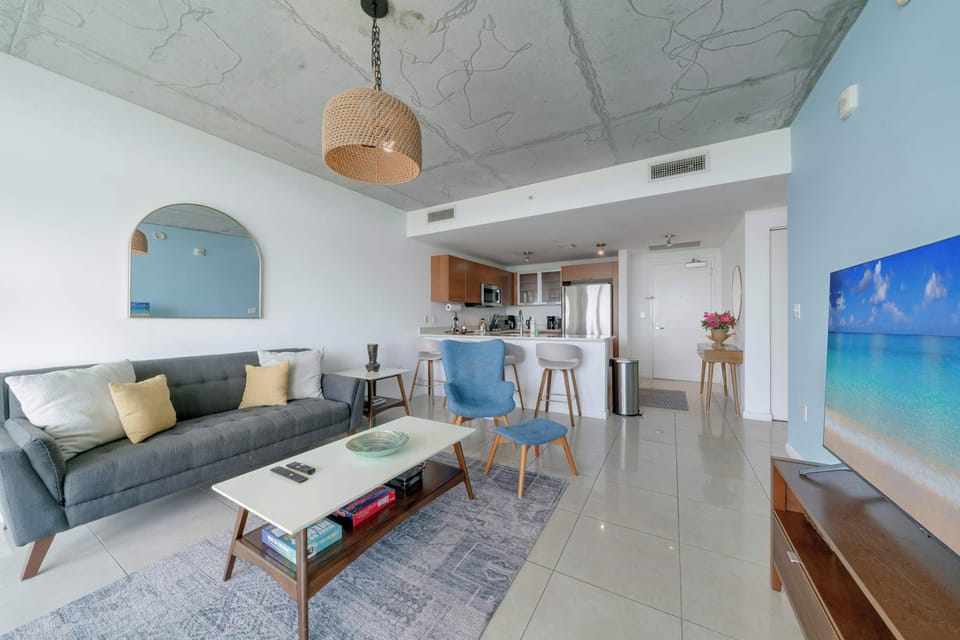 A bright, spacious living room designed for relaxing and recharging.