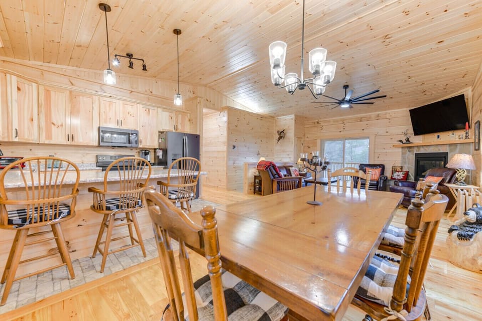 Dining & Kitchen | Spacious Layout with Breakfast Bar and Rustic Wood Accents