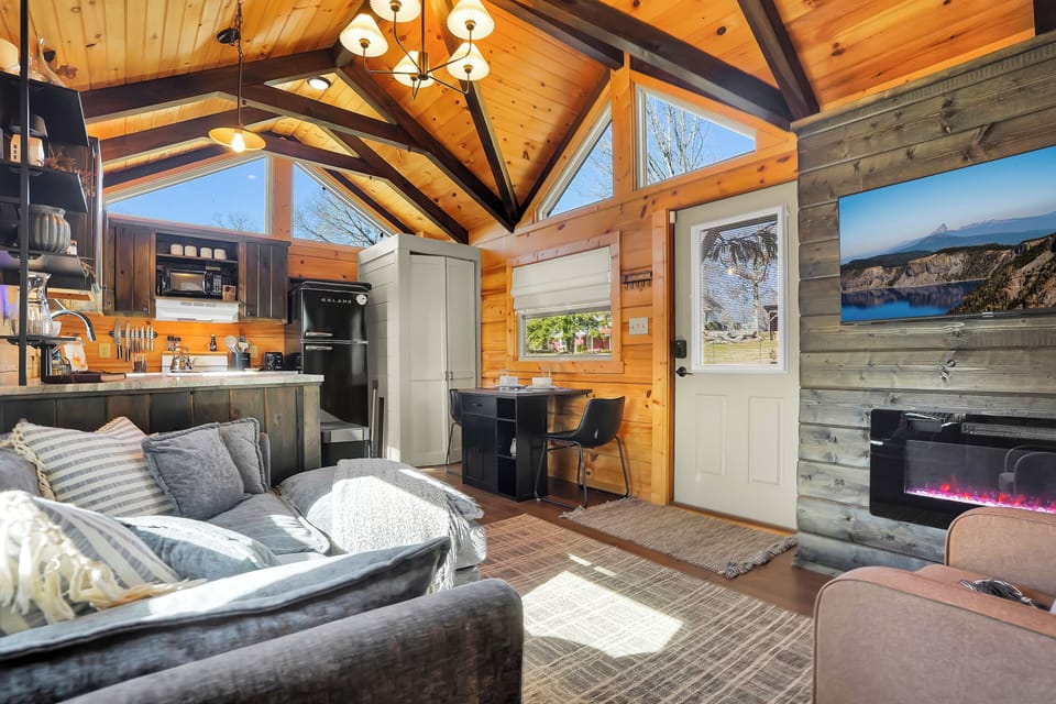 The tall standing cabinet is where your laundry is locate, and the front door leads right into your cozy getaway space!