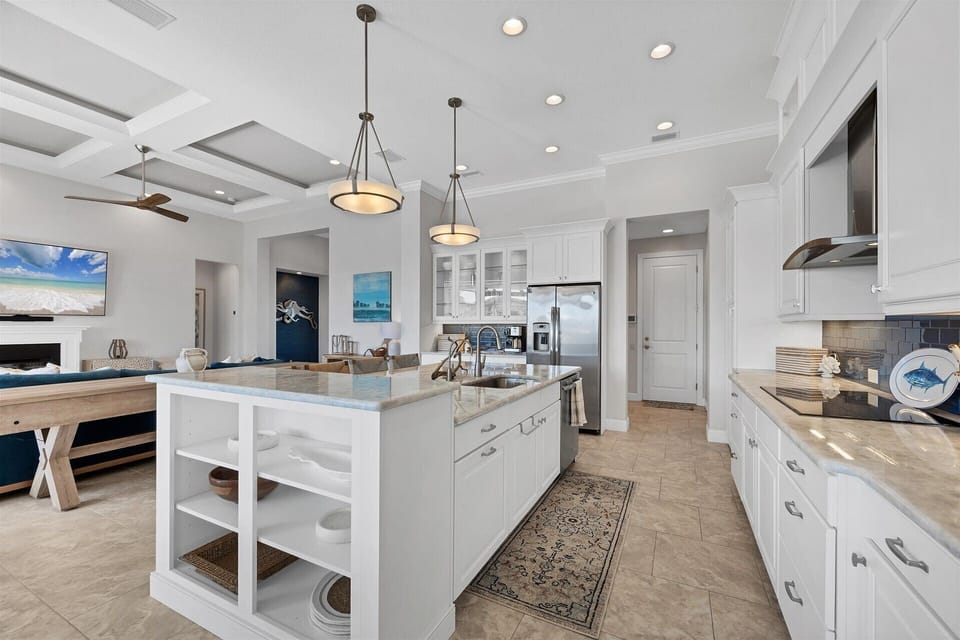 Gorgeous, fully-equipped kitchen over looking the living room and dining areas