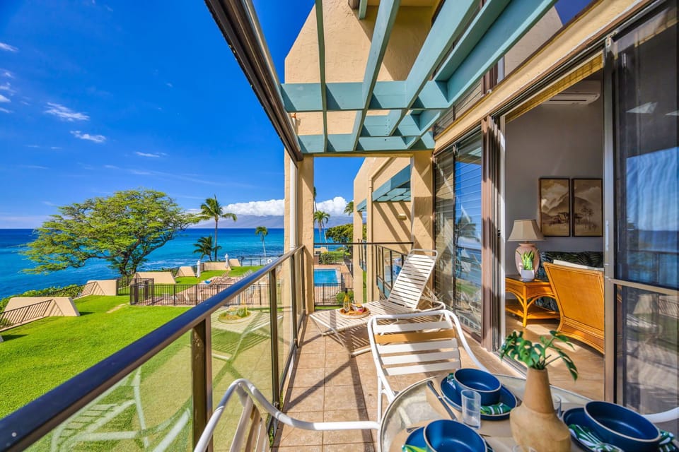 Enjoy a spacious lanai with lounge chairs and a dining area, perfectly positioned to capture stunning ocean vistas and tropical breezes.