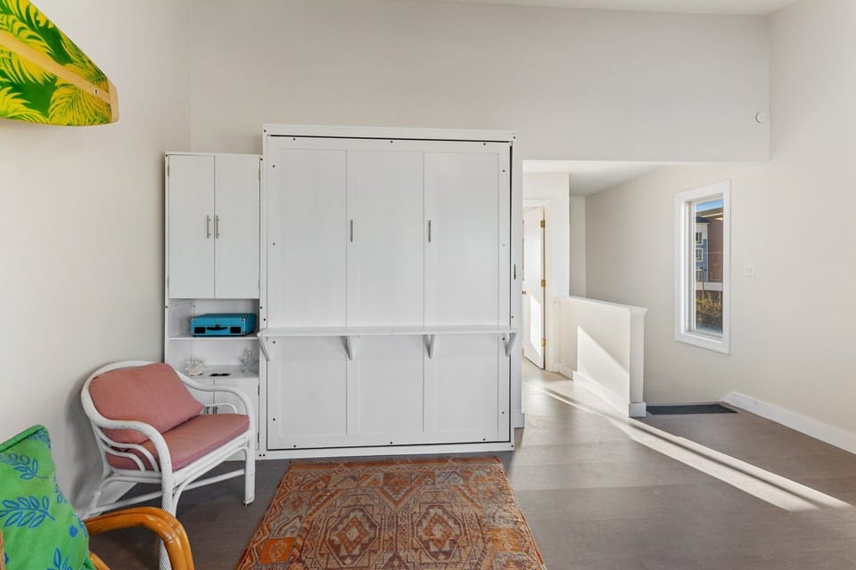 Cozy Den with Murphy Bed: Versatile den featuring a Murphy bed for additional sleeping options.