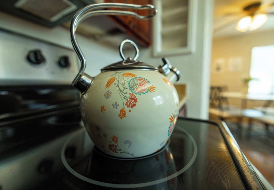 Start your mornings right with a charming kettle ready on the stove, perfect for fresh coffee or a relaxing cup of tea