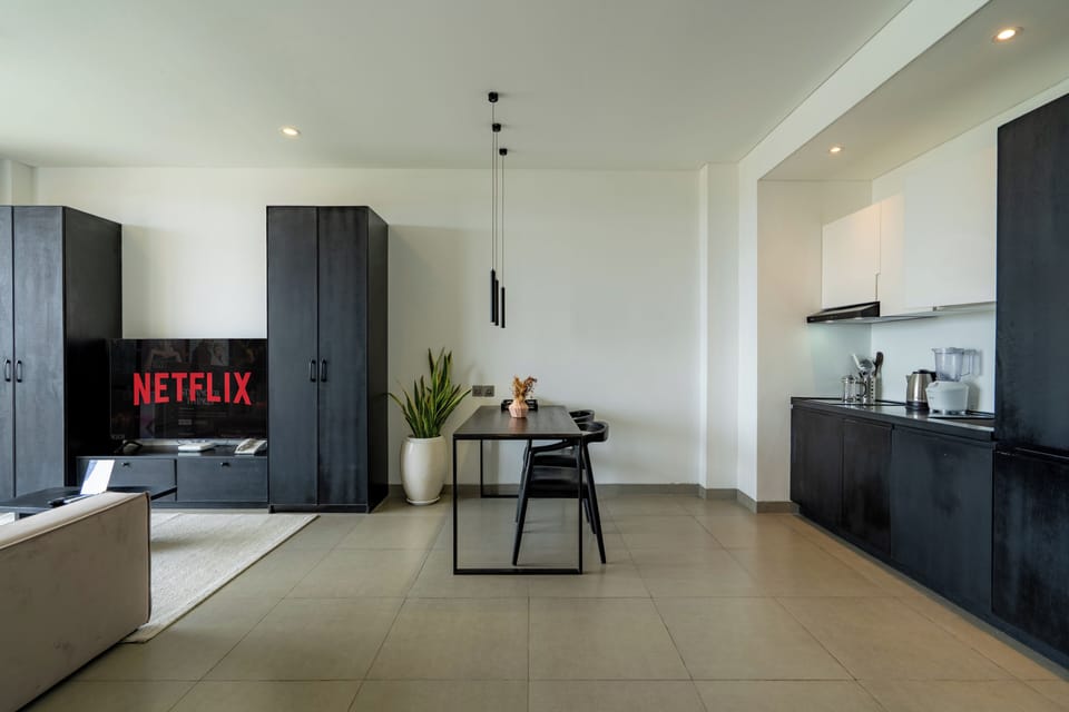 Classic Suite, Balcony | Living area | 65-inch Smart TV with digital channels