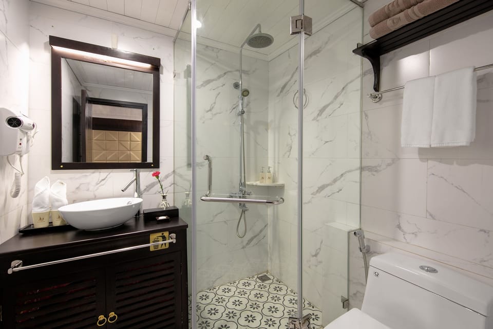 Hair dryer, slippers, towels, soap