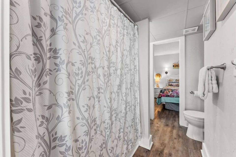 Stylish bathroom with beachy details and a walk-in shower area for refreshing after a day in the sun.