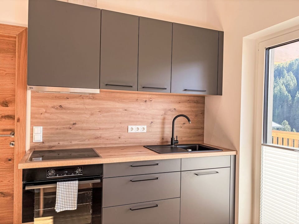 Cabinetry, Kitchen, Countertop, Furniture, Interior Design, Wood, Flooring, Kitchen Appliance, Kitchen Sink, Drawer