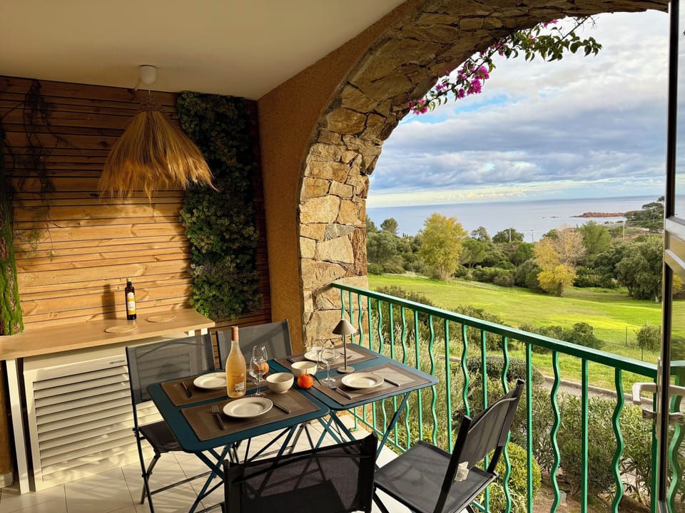 Balcony with table and chairs, lounge chairs