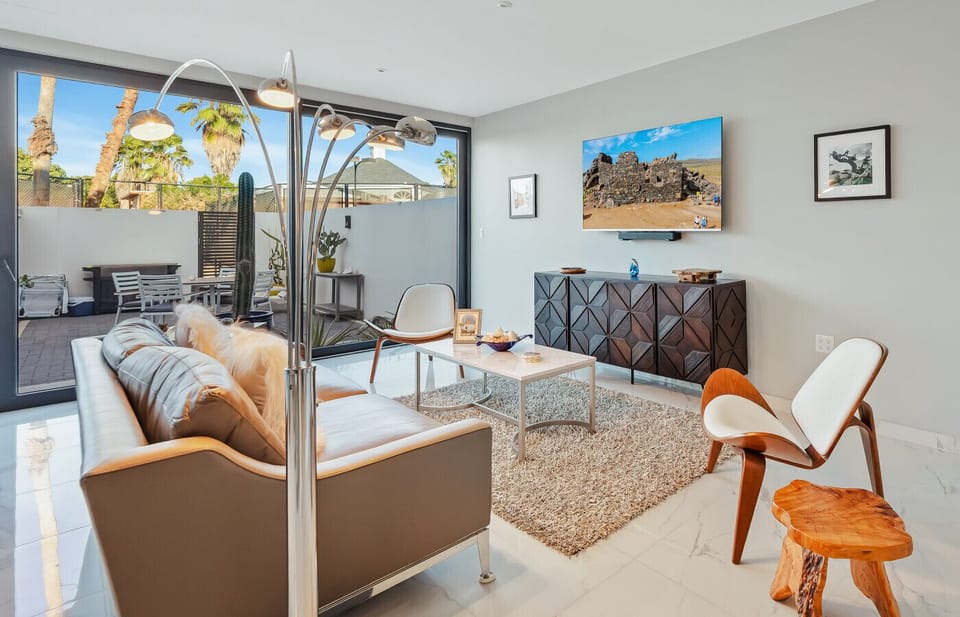 Cozy living area with smart TV and easy access to the private patio — perfect for movie nights, morning coffee, or relaxing after exploring the island.