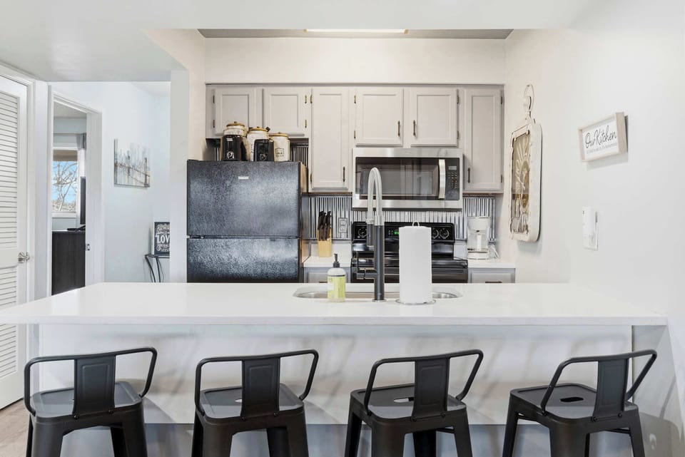The open kitchen offers ample space & all the comforts of home​