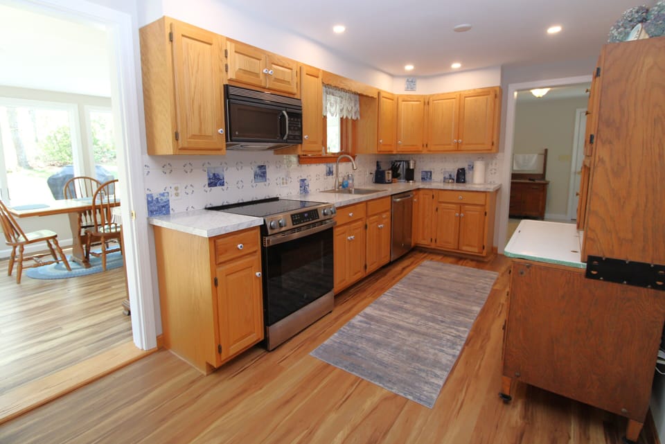 Kitchen with Sun Room In Background