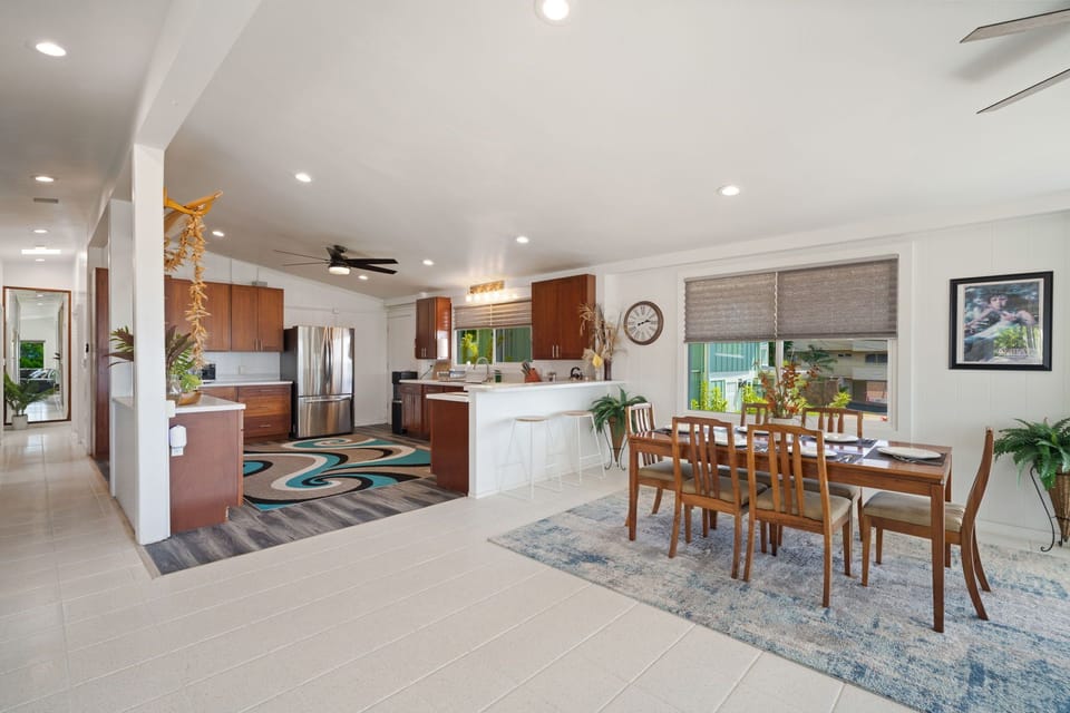 The kitchen flows right into the dining area at Hale O'Kapeka, so nobody's stuck in the kitchen while everyone else is having fun.