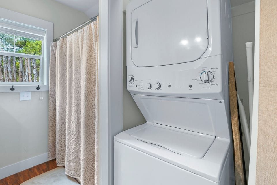 Stackable washer and dryer located in the bathroom - Coyote Cabin