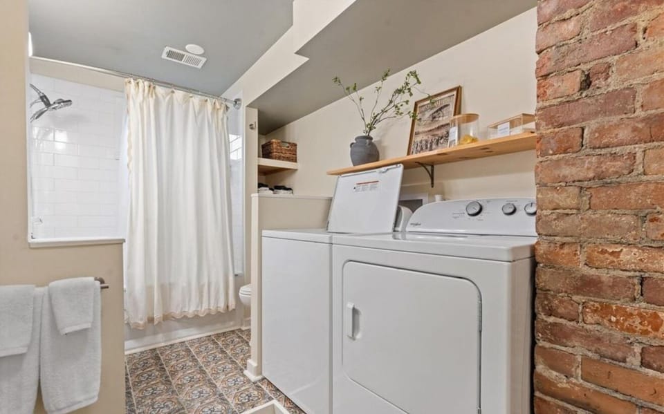 Washer/dryer located inside bathroom. 