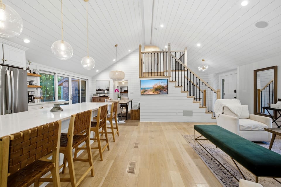 Open sightlines from kitchen to lounges make hosting seamless.