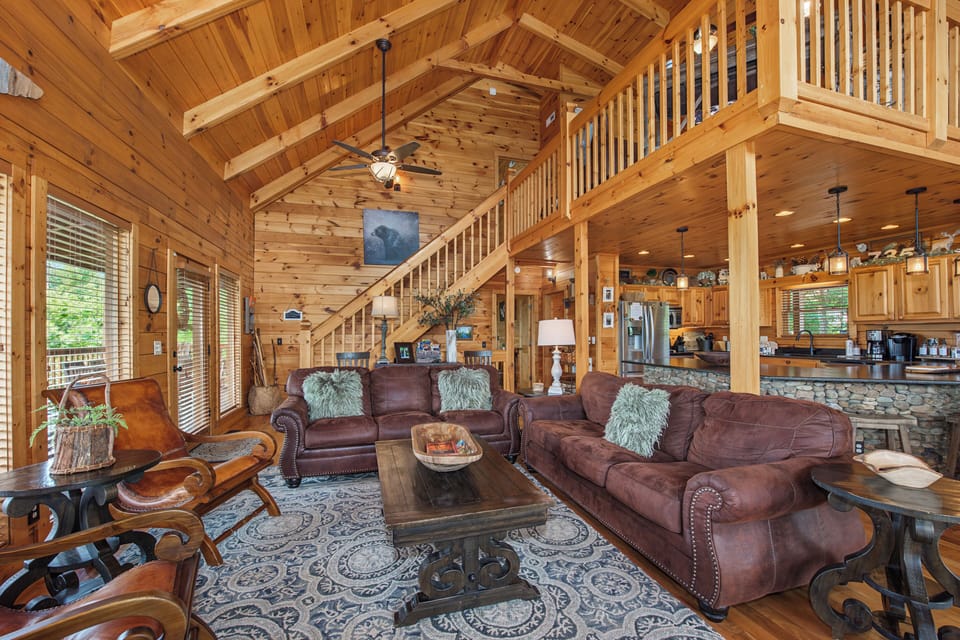 Step into your inviting mountain retreat, where soaring cathedral ceilings, warm wood finishes, and plush leather seating create the perfect space to unwind and connect with loved ones.