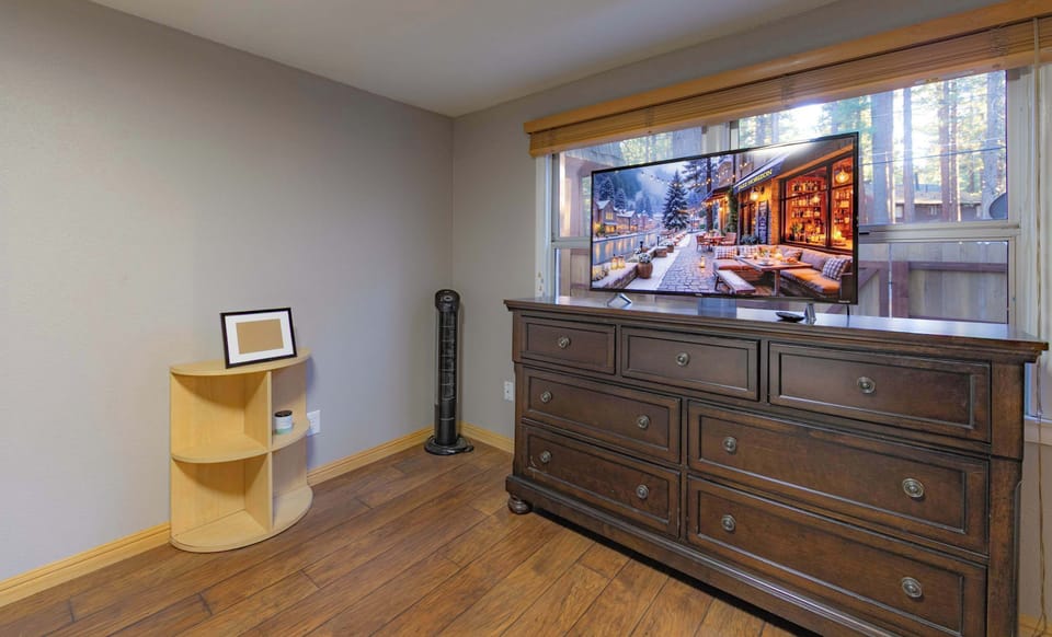 Recharge in the first-floor bedroom, offering a queen bed & smart TV​