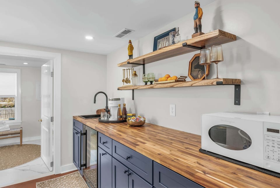 Coffee maker, Microwave, undercounter beverage refrigerator and ice maker.