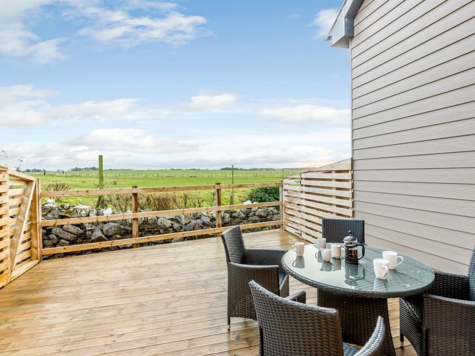 Enjoy breakfast on your private decked area before a walk to the beach