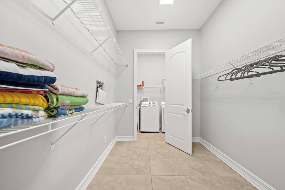 1st floor master closet (door to laundry room)