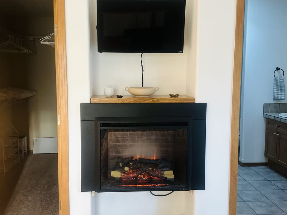 Faux fireplace heater with Smart TV in Master Suite 