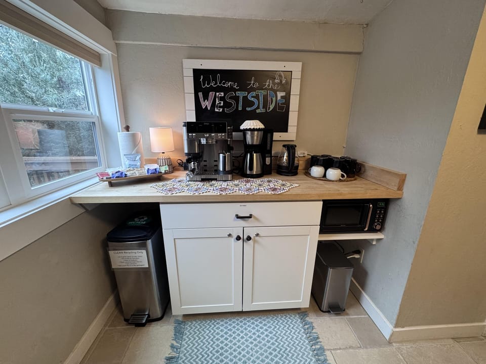 Cozy coffee nook with a Ninja 3 in 1 coffee maker as well as a standard drip coffee machine