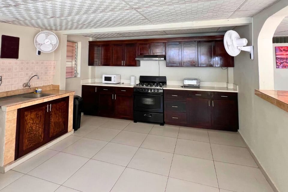 Villa | Private kitchen | Fridge, microwave, stovetop, cookware/dishes/utensils
