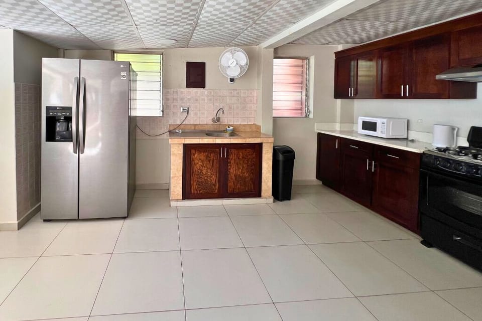 Villa | Private kitchen | Fridge, microwave, stovetop, cookware/dishes/utensils